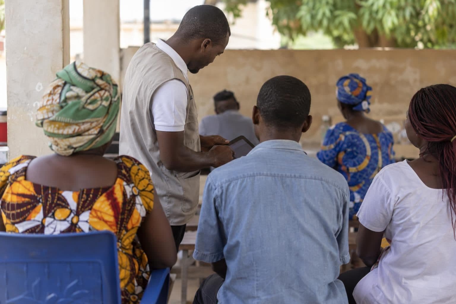 Anonymous participants at a public test of a local-language service in Lomé.