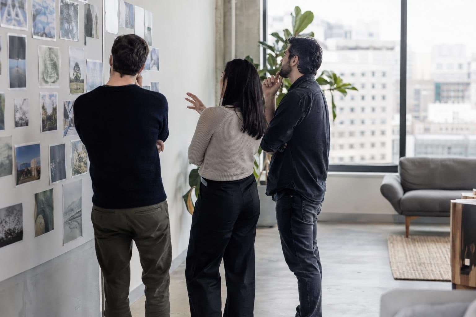 Anonymous venture-capital professionals discuss a startup investment in an unbranded workspace.